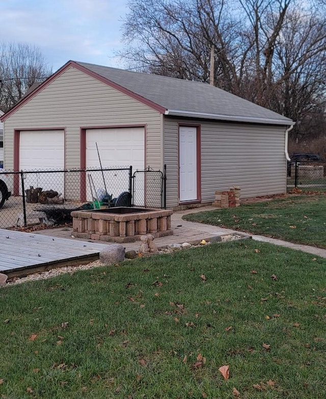 exterior space with a garage and a yard