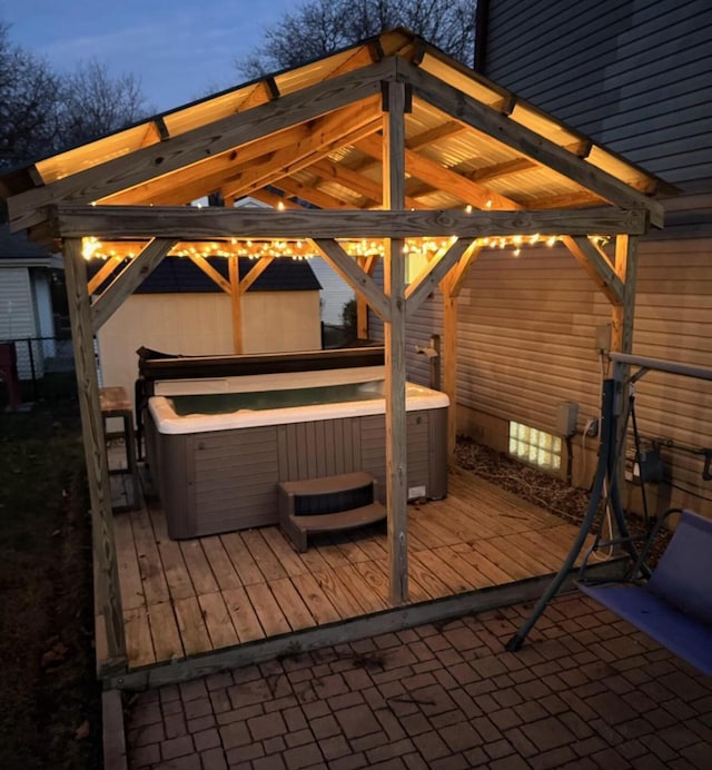 exterior space featuring a deck and a hot tub