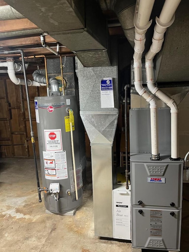 utility room with gas water heater