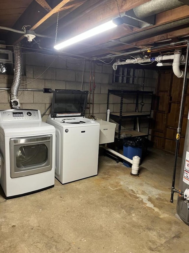 washroom featuring separate washer and dryer and sink