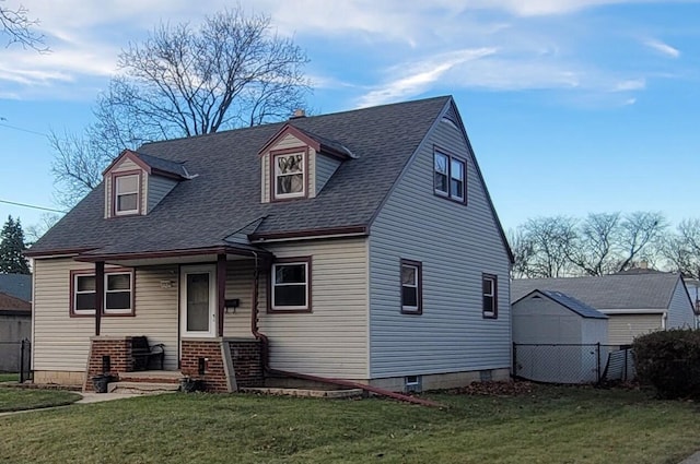 cape cod home with a front yard