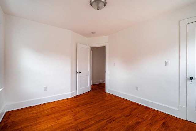 spare room with hardwood / wood-style floors