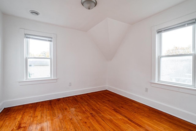 bonus room with hardwood / wood-style floors