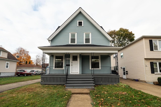 bungalow-style house with covered porch and a front yard