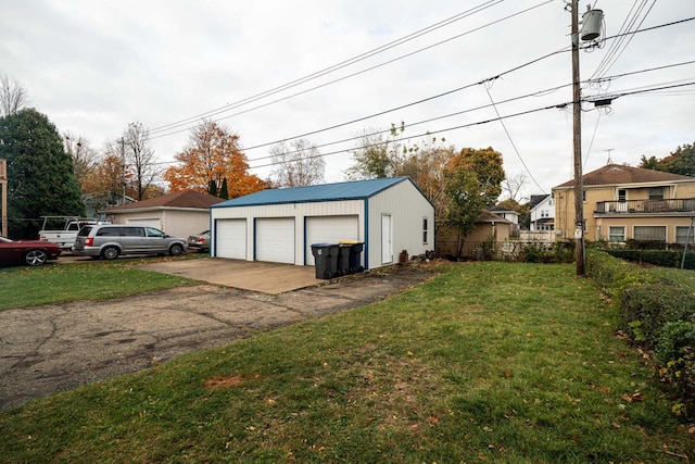 garage with a lawn