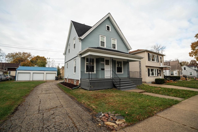 view of front of house with a porch, a front lawn, an outdoor structure, and a garage