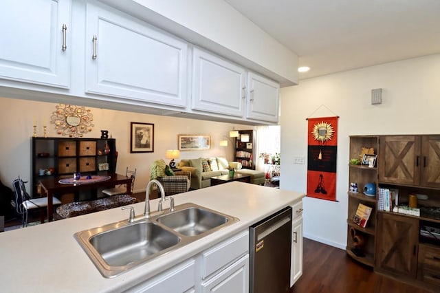 kitchen featuring stainless steel dishwasher, dark hardwood / wood-style flooring, white cabinets, and sink