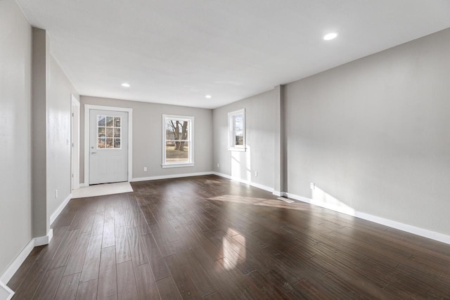 empty room featuring dark wood-type flooring