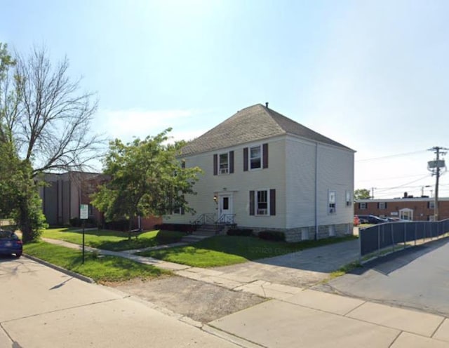 view of home's exterior with a yard