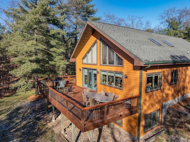 back of house featuring a wooden deck