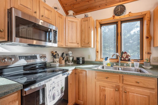 kitchen featuring stainless steel appliances, vaulted ceiling, wooden ceiling, and sink