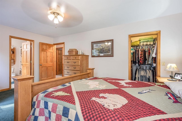 carpeted bedroom with ceiling fan, a spacious closet, connected bathroom, and a closet