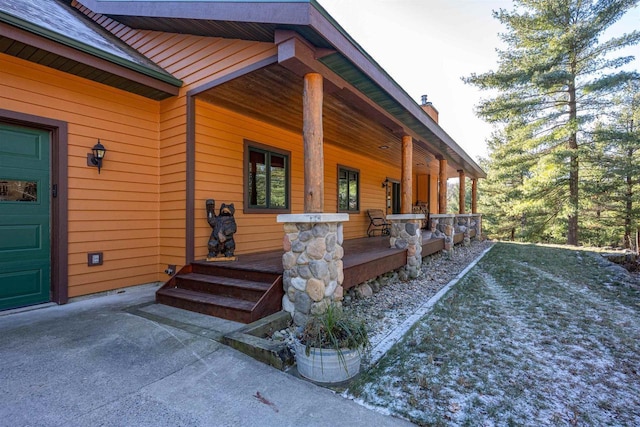 view of property exterior featuring covered porch