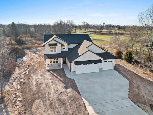 view of front of property with covered porch and a garage