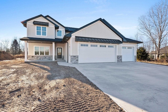 view of front of property featuring covered porch and a garage