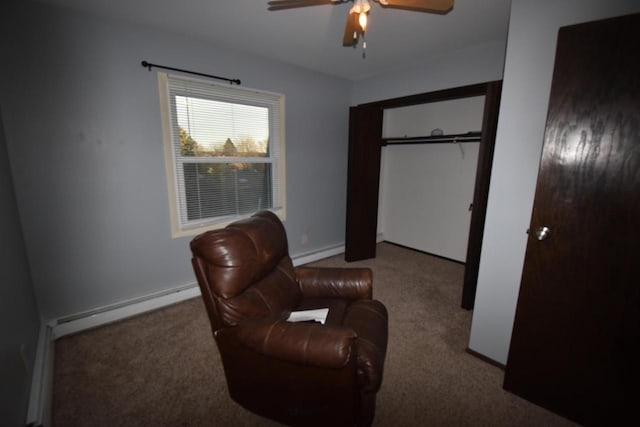 living area featuring ceiling fan, carpet floors, and a baseboard heating unit