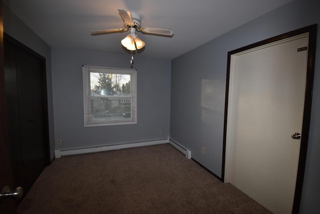 unfurnished bedroom with ceiling fan, carpet floors, and a baseboard heating unit