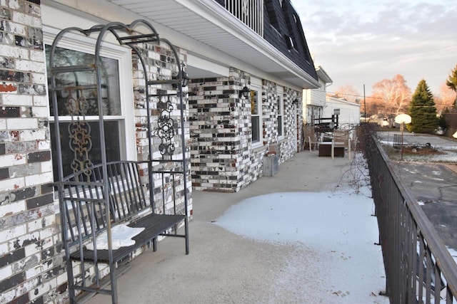 view of snow covered patio