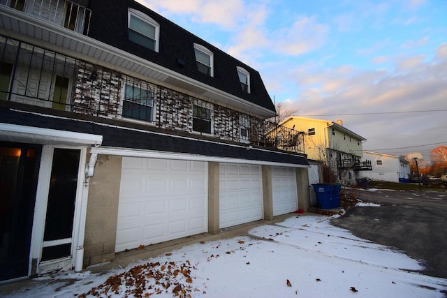 view of snow covered garage