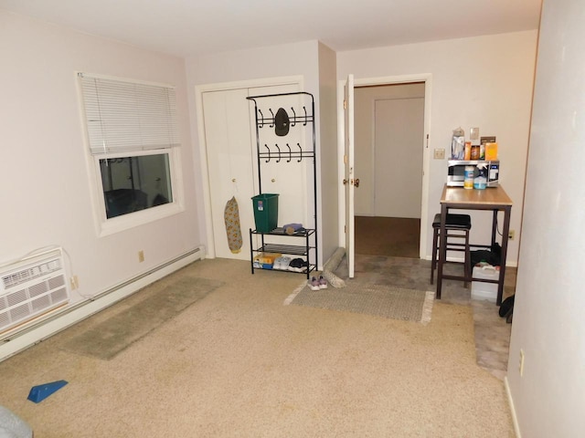 interior space with carpet flooring and a baseboard radiator