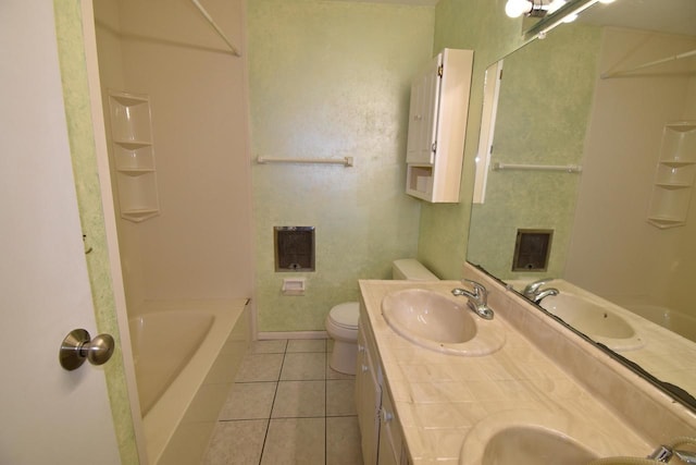 bathroom featuring tile patterned flooring, vanity, and toilet