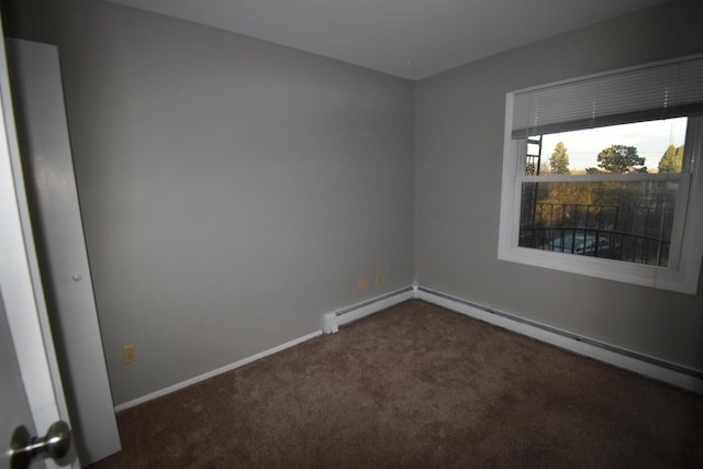 unfurnished room with dark colored carpet