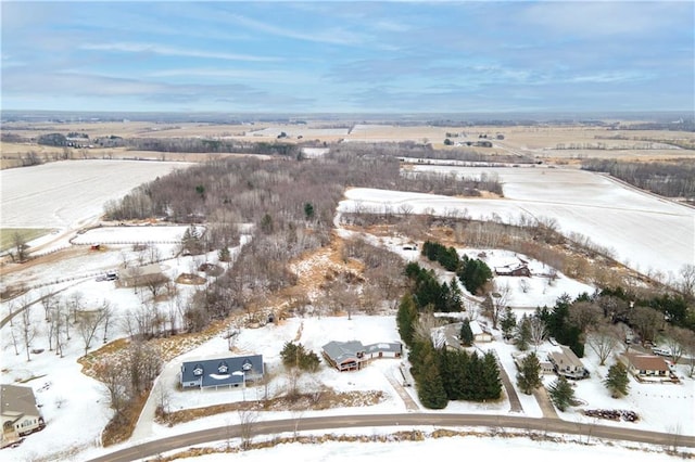 snowy aerial view featuring a rural view