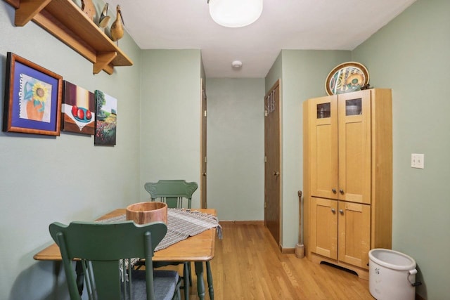 dining area with light hardwood / wood-style flooring