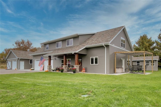 view of front of property with a pergola, a front yard, and a garage