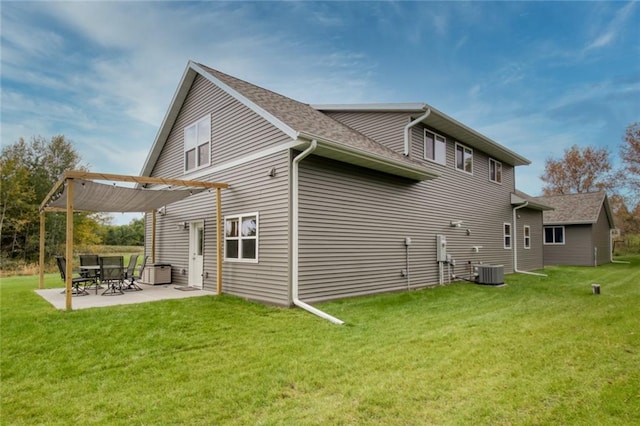 rear view of property with a lawn, a patio area, and a pergola