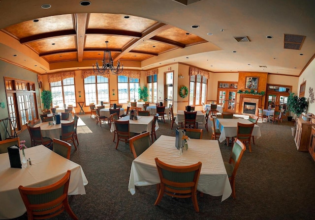 dining room featuring beam ceiling, carpet floors, coffered ceiling, and a notable chandelier