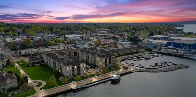 aerial view at dusk with a water view