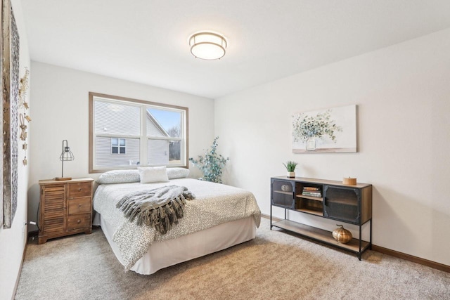 carpeted bedroom with baseboards