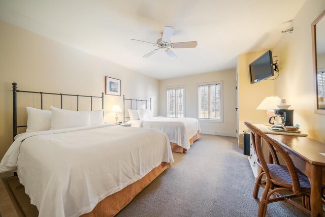 bedroom with ceiling fan and carpet