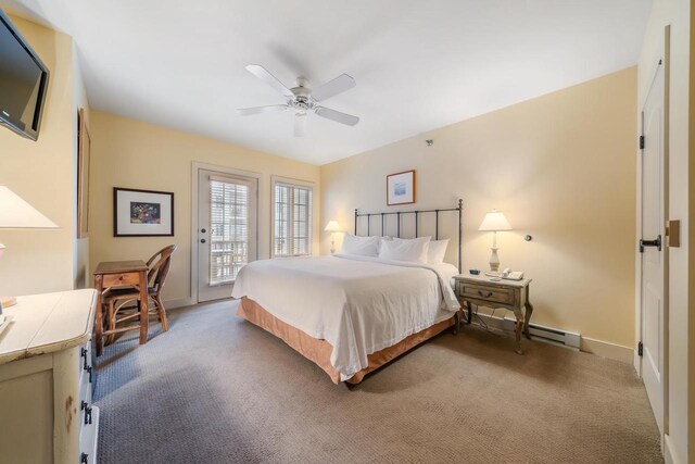 carpeted bedroom with ceiling fan, access to exterior, and baseboard heating