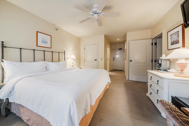 carpeted bedroom featuring ceiling fan