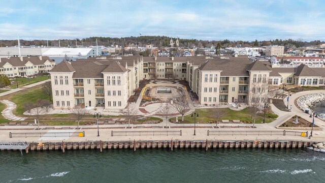 birds eye view of property with a water view