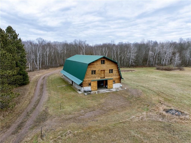 view of outbuilding with a yard