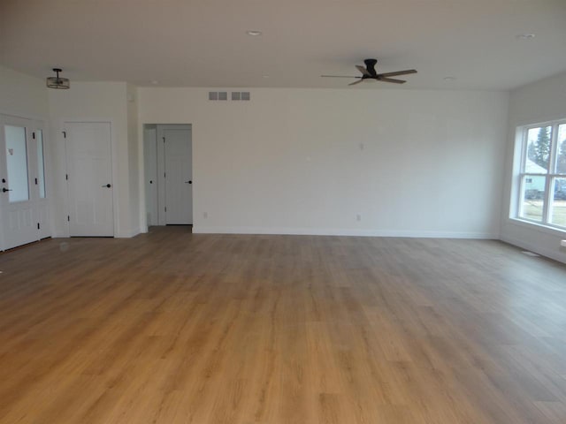 unfurnished room with light hardwood / wood-style floors and ceiling fan