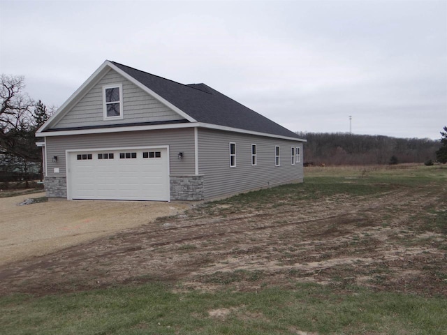 view of side of property with a garage