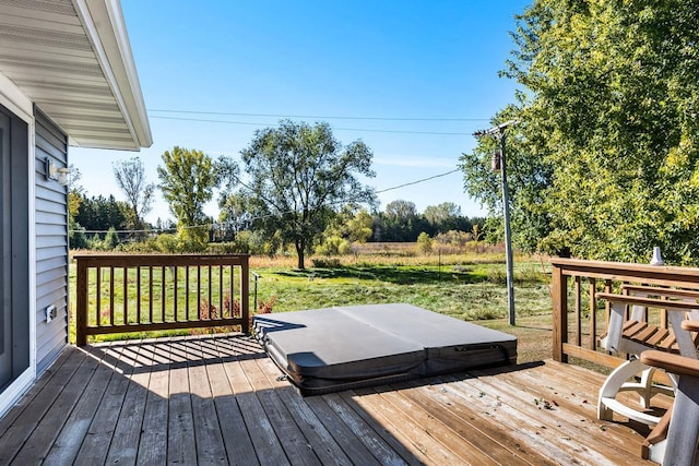 wooden deck with a covered hot tub