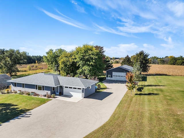 view of front facade with a front yard and a garage