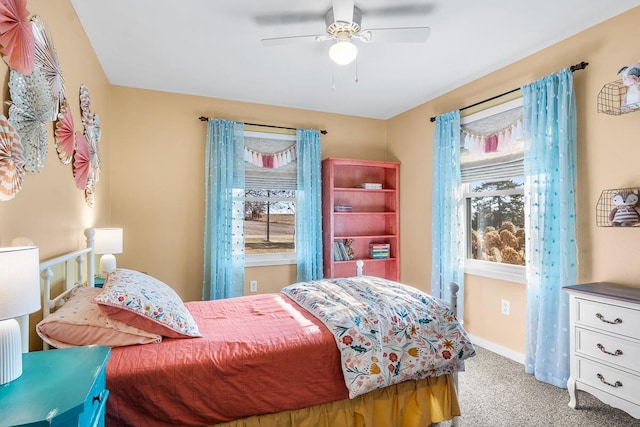 carpeted bedroom featuring ceiling fan