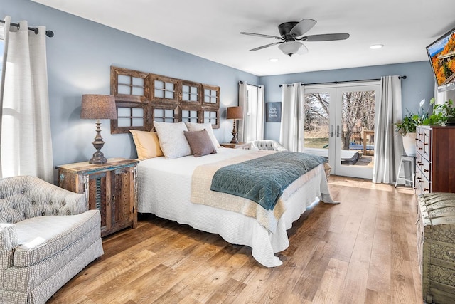 bedroom with access to exterior, french doors, light hardwood / wood-style floors, and ceiling fan