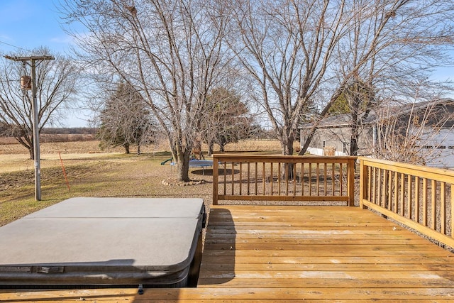 wooden terrace with a covered hot tub