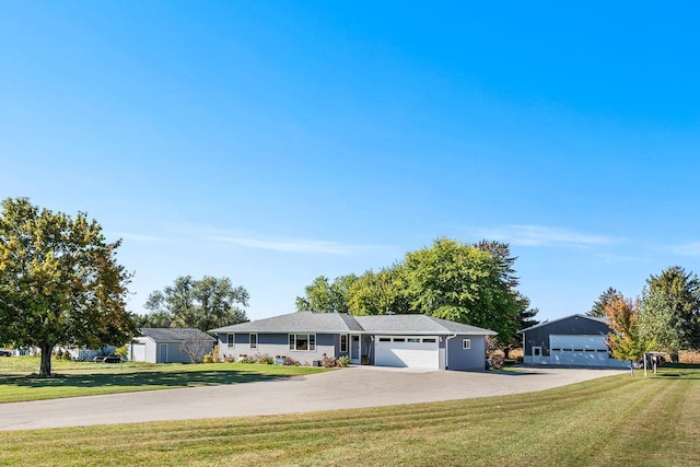 ranch-style house with a garage and a front lawn