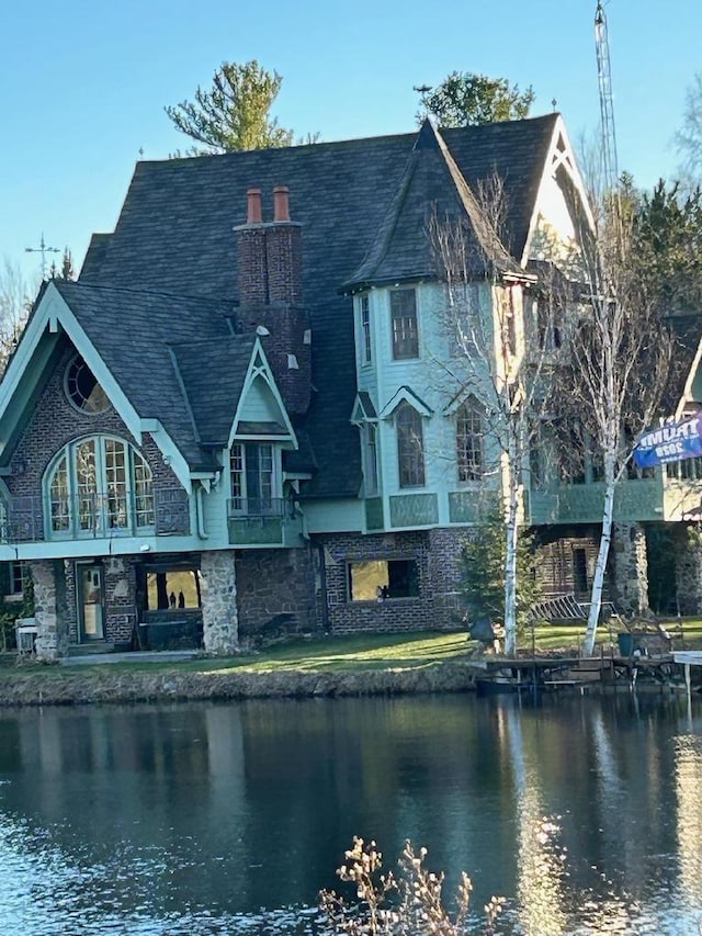 exterior space with a yard and a water view