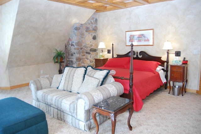 carpeted bedroom featuring beamed ceiling