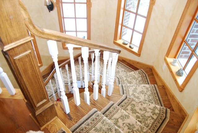 stairway featuring wood-type flooring