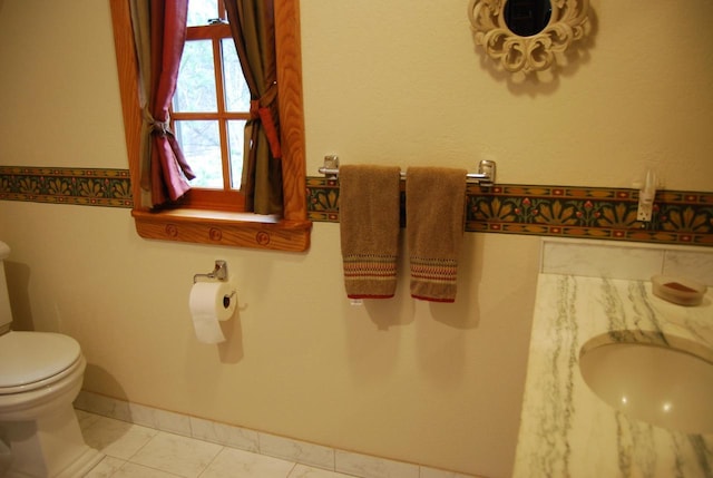 bathroom featuring tile patterned floors and toilet